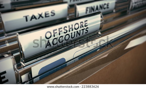Folder tabs with focus on\
offshore account tab. Business concept image for illustration of\
tax evasion.