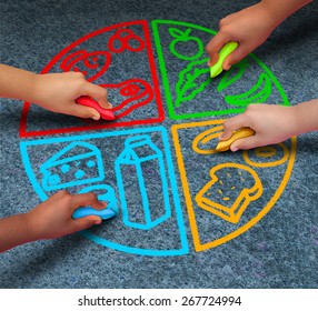 Food Groups Nutrition And Healthy Lifestyle Concept As A Group Of Diverse Children Holding Chalk Drawing A Pie Chart Diagram On Asphalt With Protein Dairy Fruits And Vegetables And Starch Symbols.