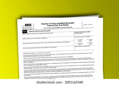 Form 8855 papers. Election to Treat a Qualified Revocable Trust as Part of an Estate. Form 8855 documentation published IRS USA 44147. American tax document on colored