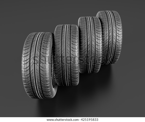 Four car\
tires on black background.  3d\
illustration