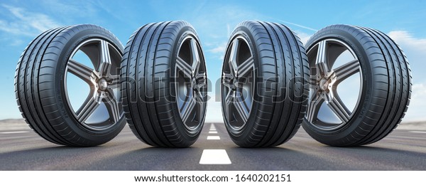 Four car wheel oln the highway with sky\
background.  Change a tires. 3d\
illustration
