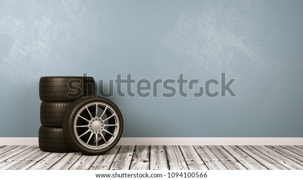 Four Car Wheels on Wooden Floor Against\
Blue Gray Wall with Copy Space 3D\
Illustration