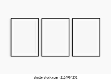 Frame mockup 5x7, 50x70, A4, A3, A2, A1. Set of three thin black frames. Gallery wall mockup, set of 3 frames. Clean, modern, minimalist, bright. Portrait. Vertical. Passepartout (mat) opening 2:3.