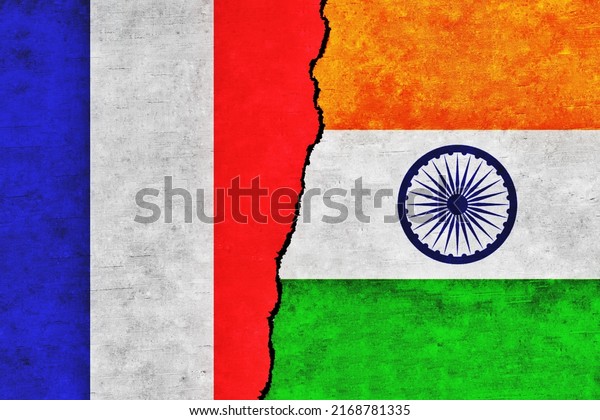 France and\
India painted flags on a wall with a crack. France and India\
relations. India and France flags\
together