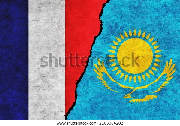 France and Kazakhstan painted flags on a wall\
with a crack. France and Kazakhstan relations. Kazakhstan and\
France flags\
together