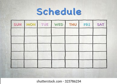 Freehand pen doodle sketch drawing of blank monthly grid timetable schedule on cement wall background - Powered by Shutterstock