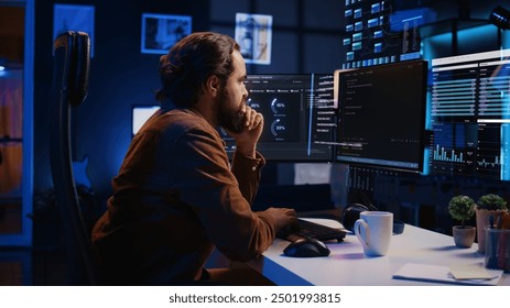 Freelancer working on computer, using AR augmented reality tech to do coding. Remote worker at home using augmented reality technology to visualize programming parameters - Powered by Shutterstock