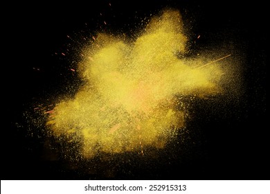 Freeze Motion Of Colorful Yellow Powder Exploding Isolated On Black Dark Background. Abstract Design Of Color Dust Cloud. Particles Explosion Screen Saver, Wallpaper, Brush