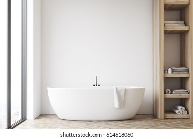 Front View Of A Bathroom Interior With A White Tub, A Wooden Closet And White Wall. 3d Rendering, Mock Up