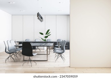 Front view of blank beige wall with place for frame or poster and modern meeting room interior with office desk and chairs on background, mockup. 3D Rendering