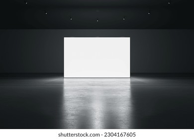 Front view of blank white glowing digital screen in dark hall interior with concrete floor and black wall. Presentation concept. Mockup, 3D Rendering - Powered by Shutterstock