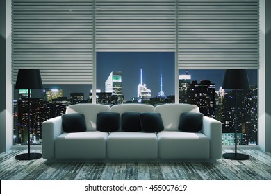 Front View Of Modern Living Room Interior With Black Pillows On White Couch, Floor Lamps, Wooden Floor And Panoramic Window With Blinds And Illuminated Night City View. 3D Rendering