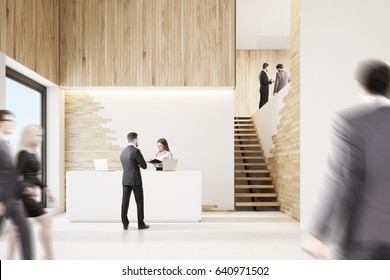 Front View Of An Office Lobby With Business People, A White Reception Counter And Stairs. 3d Rendering