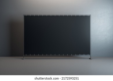Front View On Blank Black Billboard With Space For Your Text Or Logo In The Center Of Empty Room With Glossy Floor And Dark Concrete Wall Background. 3D Rendering, Mockup