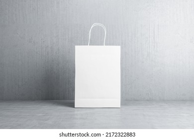 Front View On Blank White Paper Shopping Bag With Space For Your Logo Or Text On Concrete Floor On Grey Background. 3D Rendering, Mockup