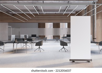 Front View On Blank White Poster With Place For Your Logo Or Text On Light Concrete Floor In Spacious Coworking Office With Minimalistic Workspaces. 3D Rendering, Mockup