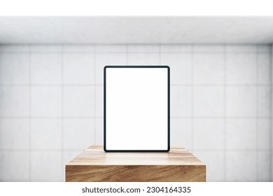 Front view on blank white modern digital tablet screen with space for web design, website or application on wooden stage in empty room with light tiles wall background. 3D rendering, mock up