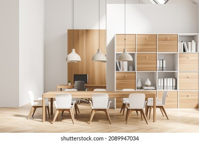 Front view on bright office room interior with two desktops, comfortable armchairs, desks and oak wooden parquet floor. Perfect place for working process. Minimalist design. 3d rendering