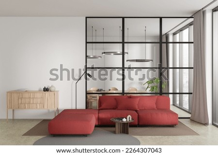 Front view on bright studio room interior with white wall, couch, armchair, coffee table, concrete floor, glass partition, panoramic window, dining table. Concept of minimalist design. 3d rendering