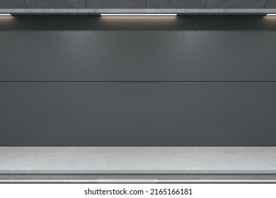 Front View On Dark Grey Blank Wall For Advertising Billboard In Empty Subway Station With Rails And Concrete Floor. 3D Rendering, Mockup
