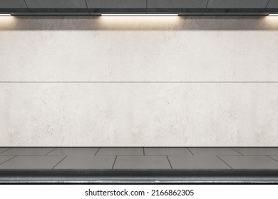 Front view on light grey blank wall for advertising billboard in empty metro station with rails and dark floor. 3D rendering, mockup