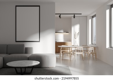 Front View On Modern Bright Studio Room Interior With Empty White Poster, Dining Table, Window, Chairs, Sofa, White Walls, Concrete Floor, Fridge. Concept Of Minimalist Design. Mock Up. 3d Rendering