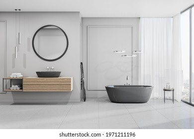 Front View On Spacious Bathroom With Wooden Furniture, Round Mirror Over Sink, Ceramic Tales Floor And City View From Big Window. 3D Rendering