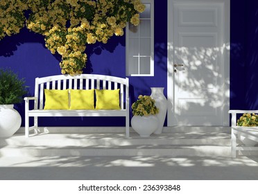 Front View Of White Door On A Dark Blue House With Window. Beautiful Yellow Roses And Bench On The Porch. Entrance Of A House.