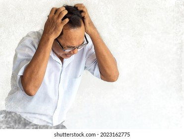 Frustrated senior man emotionally scratching his head with stress face. Portrait of elderly businessman headache, confuse, angry or depress with many problems. Old man badly itchy scalp due to allergy - Powered by Shutterstock