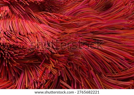 Full frame close up shot of red optical fiber