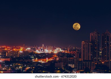 Full moon Bangkok night view with skyscraper in business district in Bangkok Thailand - Shutterstock ID 674312020