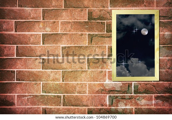 Full\
moon on wood frame on vintage brick wall\
background