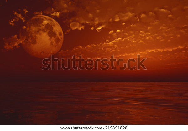 full moon over sea in clouds. Elements of this image\
furnished by NASA