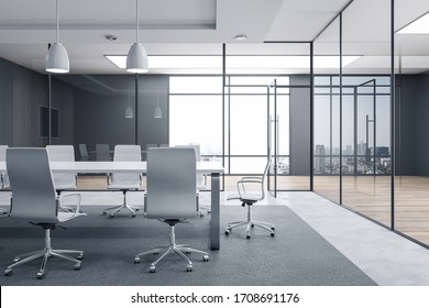 Futuristic conference room interior with blank tv screen and city view. Workplace and corporate concept. 3D Rendering
