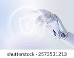 Futuristic robotic hand interacts with digital shield icon, cybersecurity. Robotic hand and digital shield emphasize security and technology. Futuristic technology with artificial intelligence.