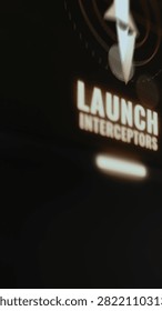 Futuristic vertical military interface showing launch interceptors command button interface