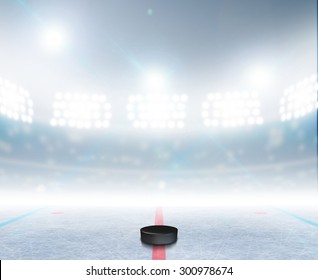 A generic ice hockey ice rink stadium with a frozen surface and a hockey puck under illuminated floodlights