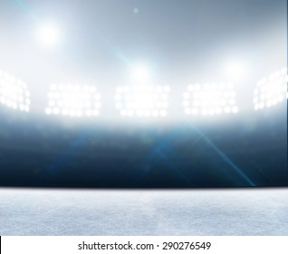 A Generic Ice Rink Stadium With A Frozen Surface Under Illuminated Floodlights