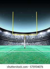 A Generic Seated American Football Stadium With Yellow Goal Posts On A Green Grass Pitch At Night Under Illuminated Floodlights - 3D Render