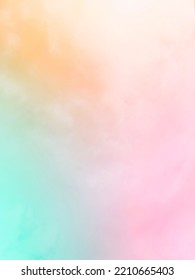 Gentle Pastel Rainbow Gradient  Of Blue, Yellow, Pink, Orange And Light Green  Blend Softly And Subtle On The Atmospheric Background Of The Natural Sky.  With A Beautiful Mist With A Faint White Cloud