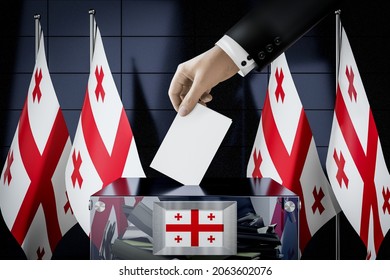 Georgia Flags, Hand Dropping Ballot Card Into A Box - Voting, Election Concept - 3D Illustration