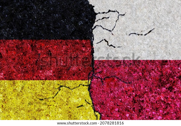 Germany and Poland painted flags on a wall with\
grunge texture. Germany-Poland conflict. Germany and Poland flags\
together