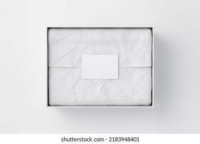 Gift Box Mock Up. White Gift Box With Blank Label Or Business Card On Wrapping Paper. White Background. Directly Above View. 3d Render