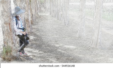 The girl holding the camera leaning against a tree in watercolor painting. - Powered by Shutterstock