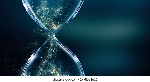 Glass hourglass on dark background with glowing sand