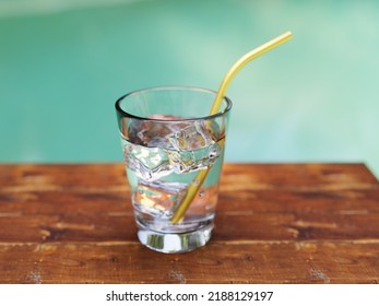 Glass Of Pure Water With Ice Cubes In Tropical Environment, 3d Rendering. 3D Illustration