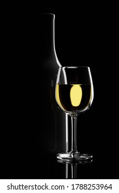 Glass Of White Wine Next To A Bottle Backlit On A Black Background. 3d Illustration.