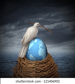 Global Peace And Hope For No War In The Middle East And The Rest Of The Planet With A White Dove Building A Nest With Twigs And A Fragile Egg With The Map Of The World On A Cloudy Sky And Ocean.