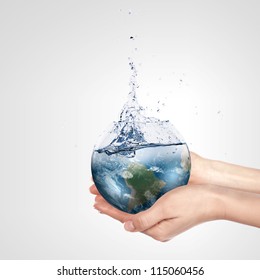 Globe in human hand against blue sky. Environmental protection concept. Elements of this image furnished by NASA स्टॉक चित्रण