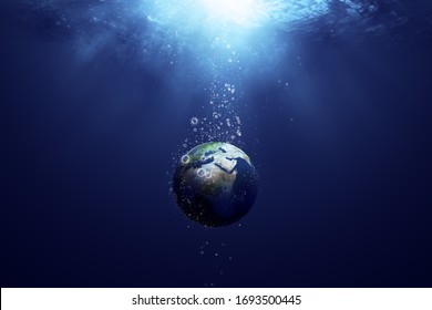 globe sinking in the deep sea, with the bubbles in coronavirus shape, idea, conceptual images.
